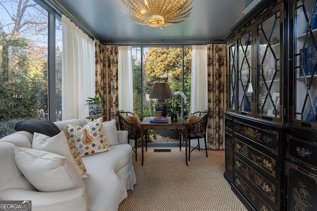 sunroom with a notable chandelier