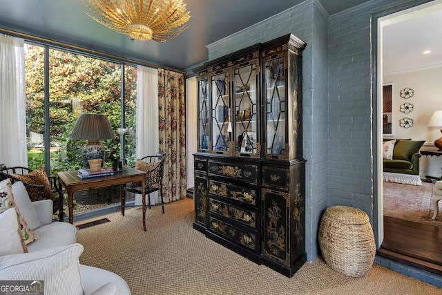 office space with crown molding and carpet flooring