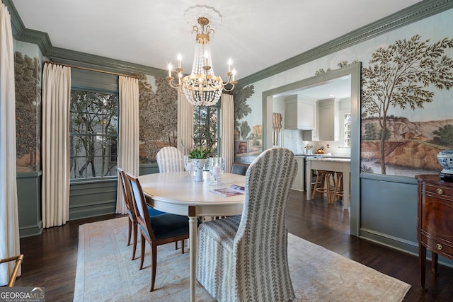 dining room featuring an inviting chandelier, dark wood-type flooring, ornamental molding, plenty of natural light, and wallpapered walls