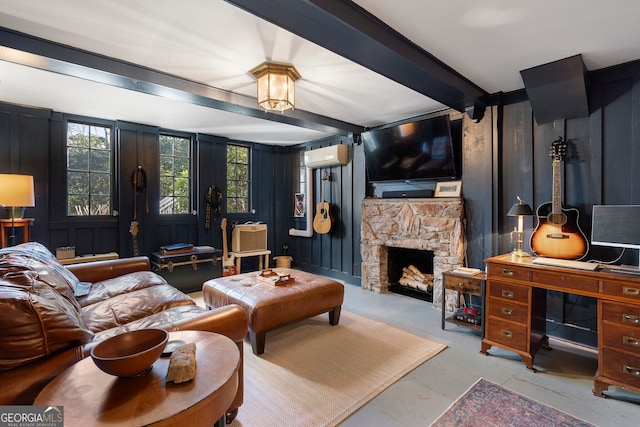 living room featuring wooden walls, a fireplace, a decorative wall, beam ceiling, and a wall mounted AC