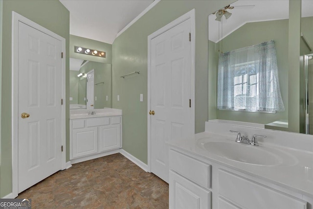 full bathroom with vaulted ceiling, ceiling fan, vanity, and baseboards