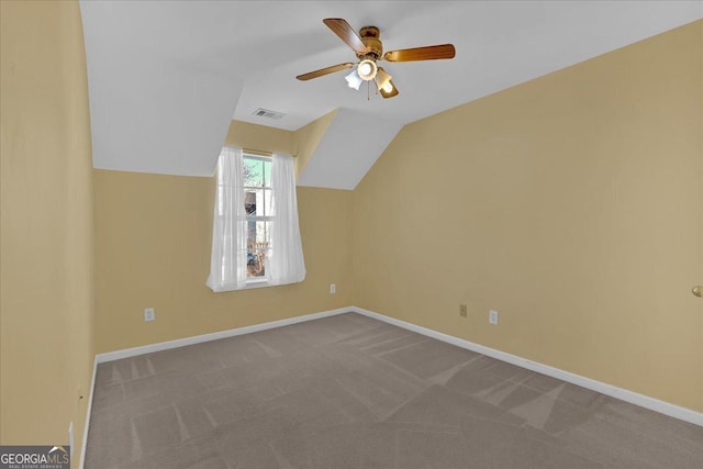 bonus room featuring ceiling fan, carpet floors, visible vents, baseboards, and vaulted ceiling