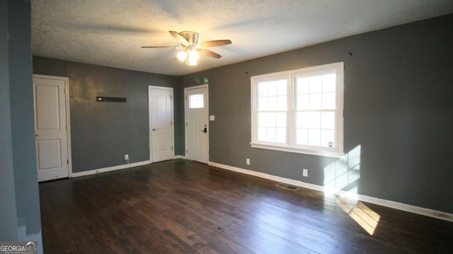 4681 City View Dr, Forest Park, GA 30297 - foyer entrance featuring ceiling fan, a textured ceiling, baseboards, and wood finished floors