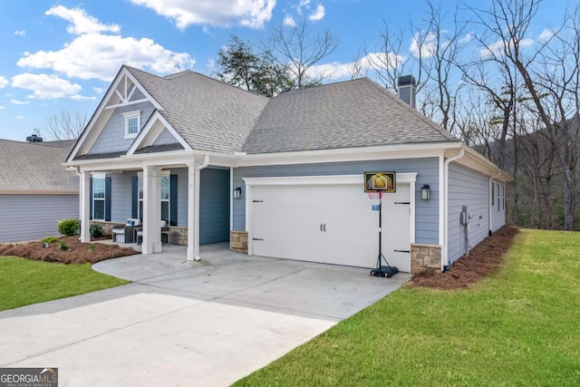 view of front of property with a shingled roof, an attached garage, stone siding, driveway, and a front lawn