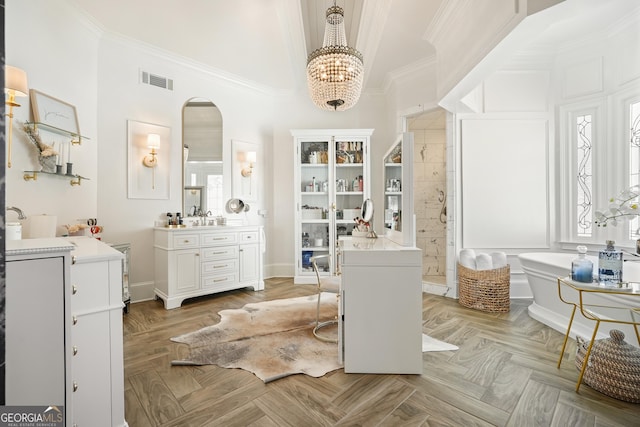 bathroom with visible vents, tiled shower, a bathtub, crown molding, and vanity