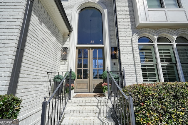 property entrance with brick siding