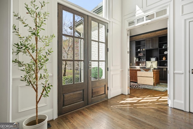 entryway featuring french doors and wood finished floors