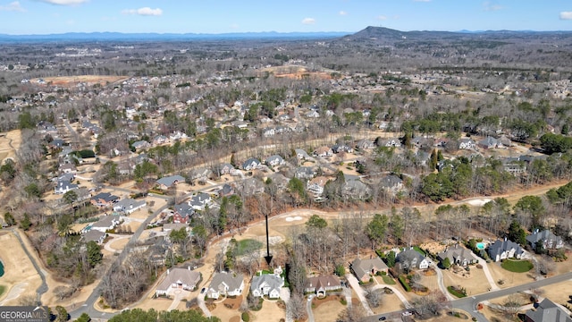 birds eye view of property with a mountain view and a residential view