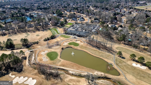 birds eye view of property featuring a water view and golf course view