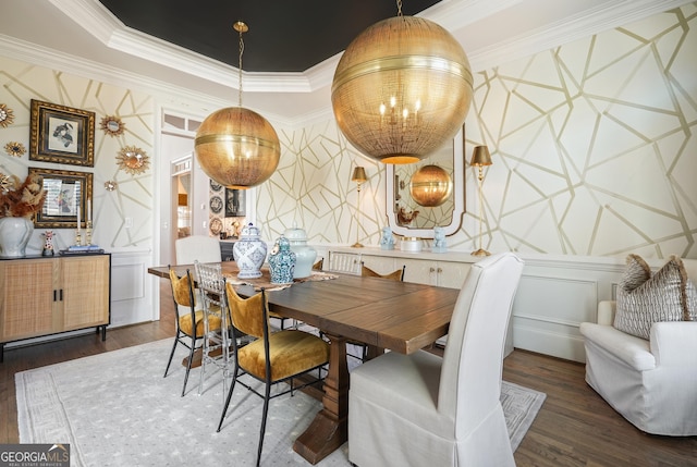 dining room featuring wallpapered walls, ornamental molding, a raised ceiling, and wood finished floors