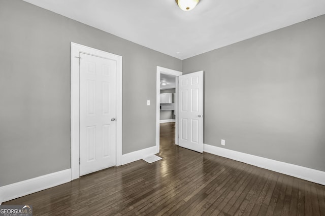 2006 Conrad Ave SE, Atlanta, GA 30315 - unfurnished bedroom with baseboards and wood finished floors