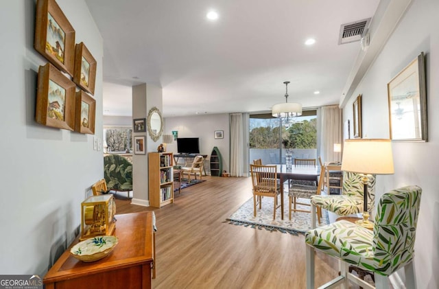 interior space featuring recessed lighting, visible vents, and wood finished floors