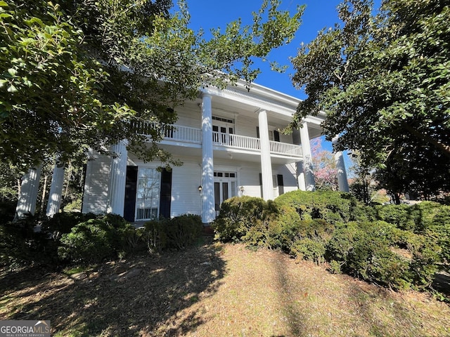 view of front of home with a balcony