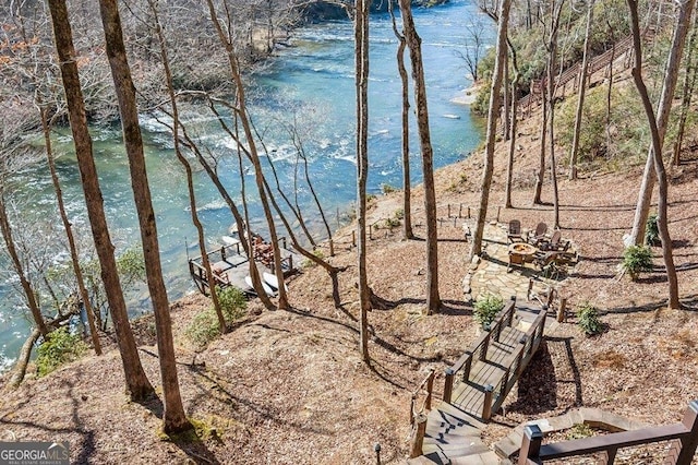 view of water feature featuring an outdoor fire pit