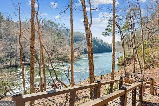 view of water feature with a wooded view