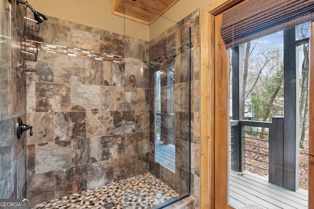 full bathroom with tiled shower