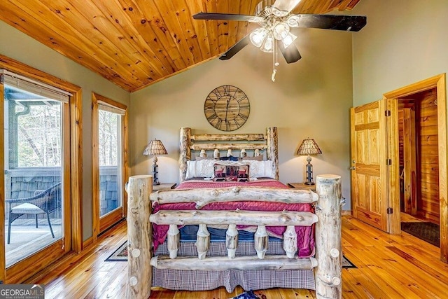 bedroom with access to exterior, lofted ceiling, wooden ceiling, and hardwood / wood-style floors