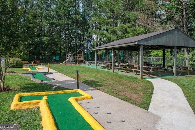 view of home's community with a gazebo, fence, playground community, and a yard