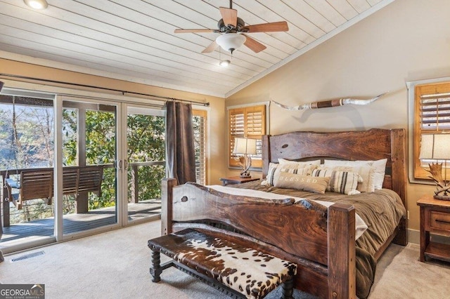 bedroom featuring visible vents, lofted ceiling, access to outside, carpet flooring, and multiple windows