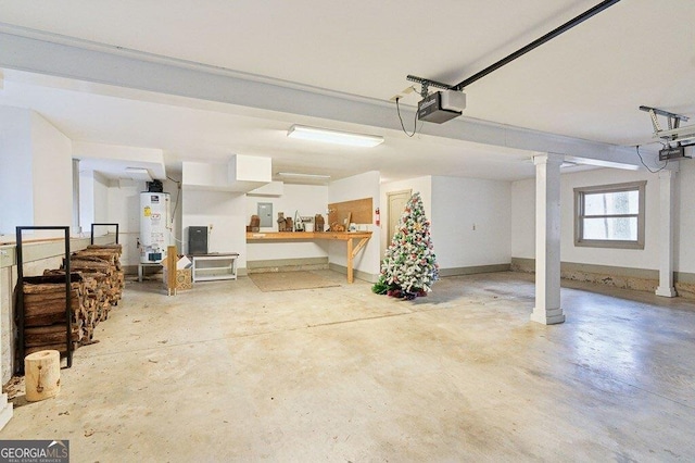 garage featuring electric panel, baseboards, gas water heater, and a garage door opener