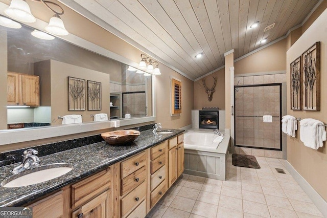 full bathroom featuring wooden ceiling, a sink, vaulted ceiling, a shower stall, and tile patterned floors