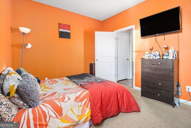 bedroom with carpet flooring and baseboards