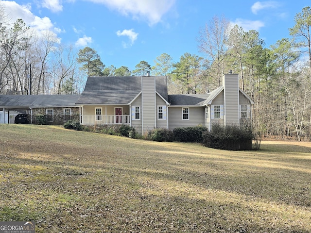 single story home with a chimney and a front yard