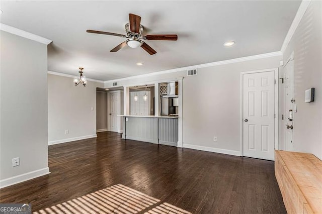 unfurnished living room with baseboards, crown molding, visible vents, and wood finished floors