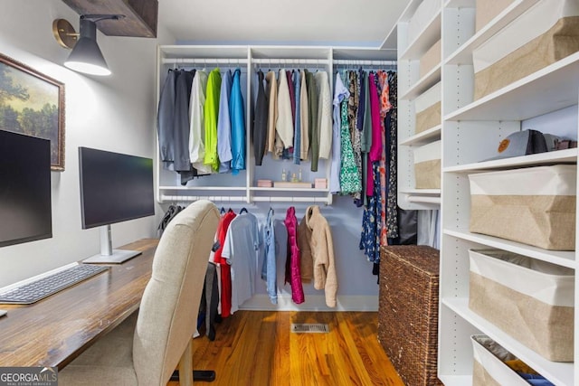 spacious closet with wood finished floors and visible vents