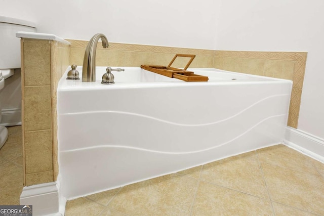 full bathroom featuring tile patterned flooring and a bath