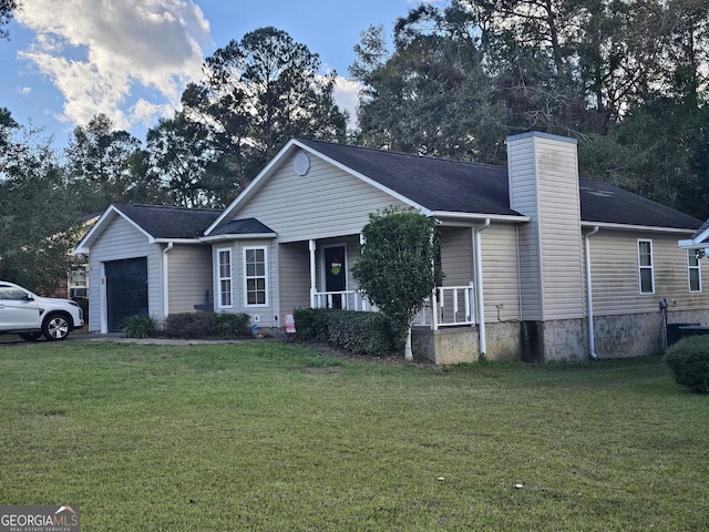 ranch-style home featuring a garage, covered porch, a chimney, and a front lawn