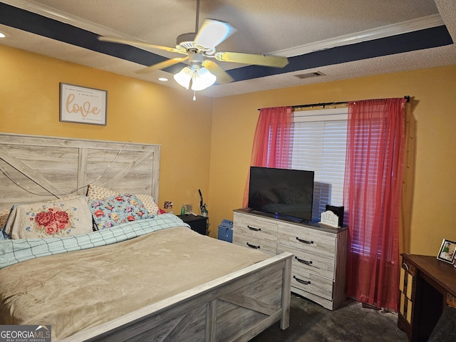 bedroom featuring a textured ceiling, dark colored carpet, visible vents, and a ceiling fan