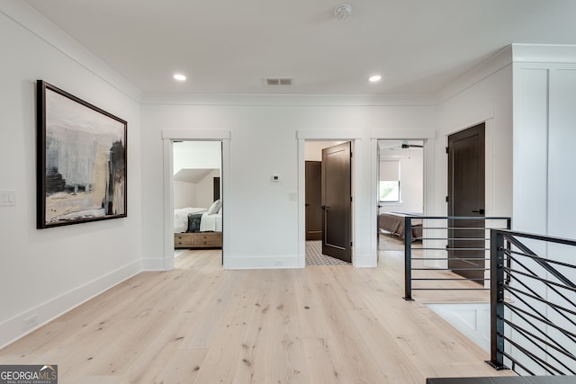corridor with visible vents, light wood-style floors, baseboards, recessed lighting, and an upstairs landing