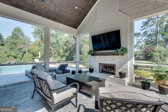 view of patio featuring an outdoor living space with a fireplace and an outdoor pool