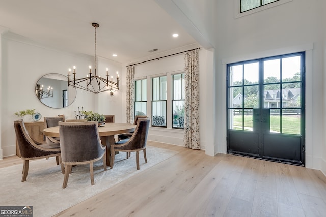 dining space with visible vents, baseboards, french doors, light wood-type flooring, and recessed lighting