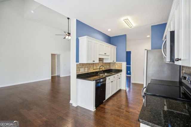 kitchen featuring dark wood-type flooring, a sink, white cabinetry, black dishwasher, and stainless steel microwave