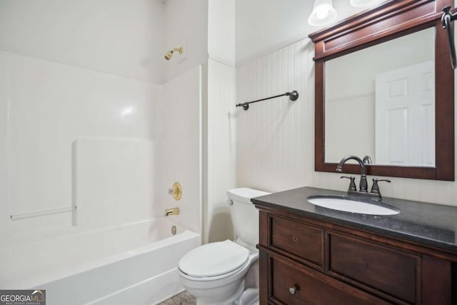 full bathroom with tub / shower combination, vanity, and toilet