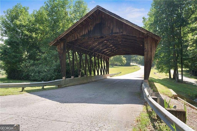 view of home's community with a carport and driveway