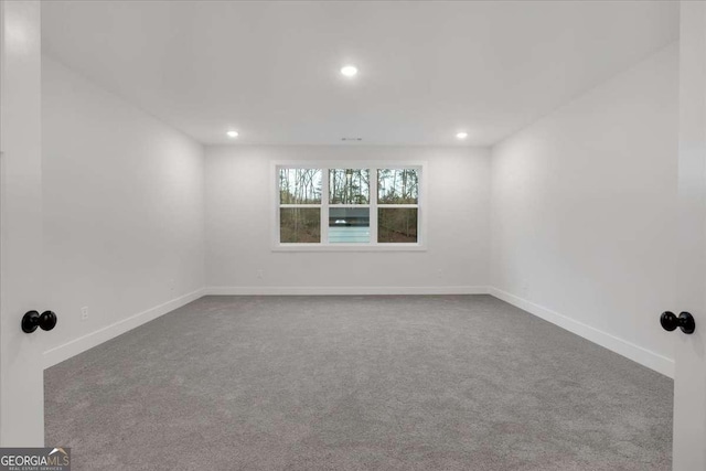 unfurnished room with baseboards, carpet flooring, and recessed lighting