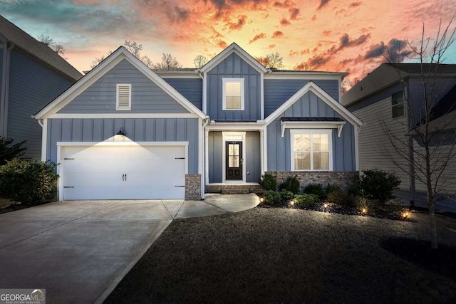 view of front of home featuring a garage, board and batten siding, and concrete driveway