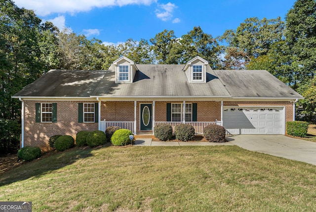 cape cod home with brick siding, a porch, a front yard, a garage, and driveway