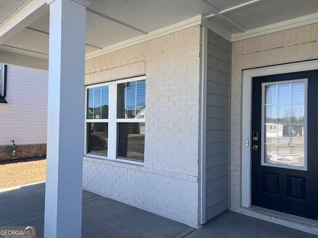 doorway to property featuring covered porch