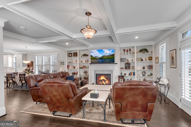 living area with a warm lit fireplace, coffered ceiling, dark wood finished floors, and beamed ceiling