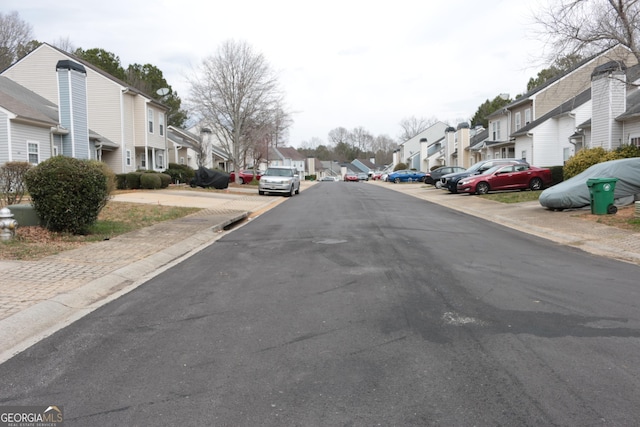 view of road with curbs and a residential view