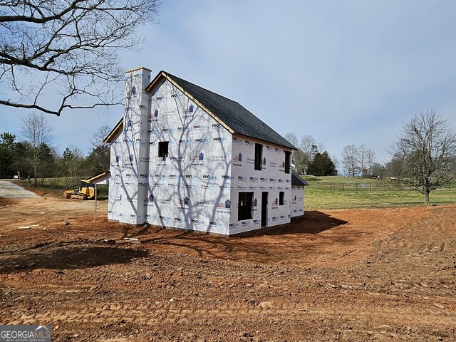 view of home's exterior featuring a chimney