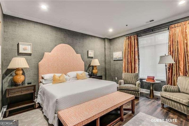 bedroom featuring recessed lighting, visible vents, crown molding, and wood finished floors