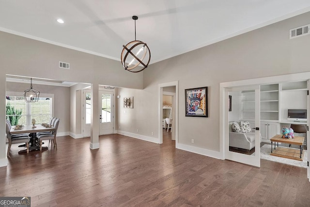 foyer entrance with visible vents and wood finished floors