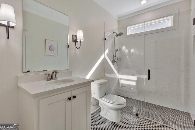 bathroom featuring vanity, a shower stall, toilet, and tile patterned floors