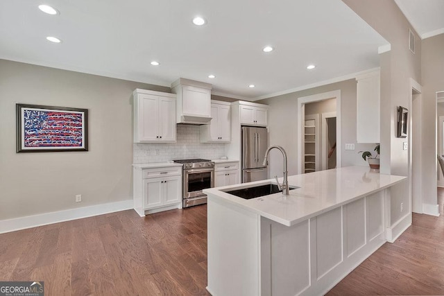 kitchen featuring stainless steel appliances, dark wood-style flooring, white cabinets, and a sink