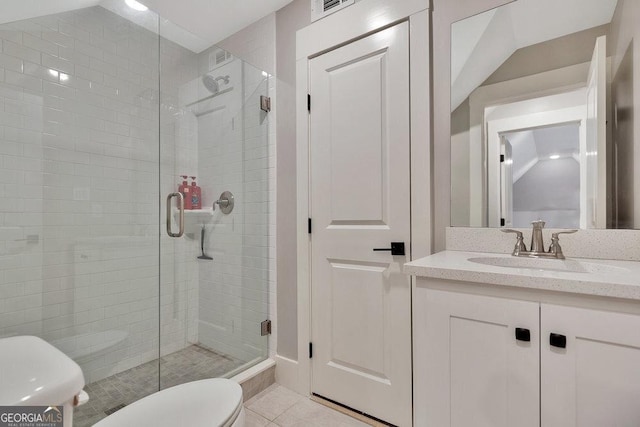 full bathroom with tile patterned flooring, a shower stall, toilet, and vanity